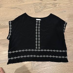 Flannel designer. Beautiful women’s black top with white flowers. Size small